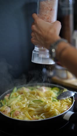 cooking creamy shrimp and zucchini pasta