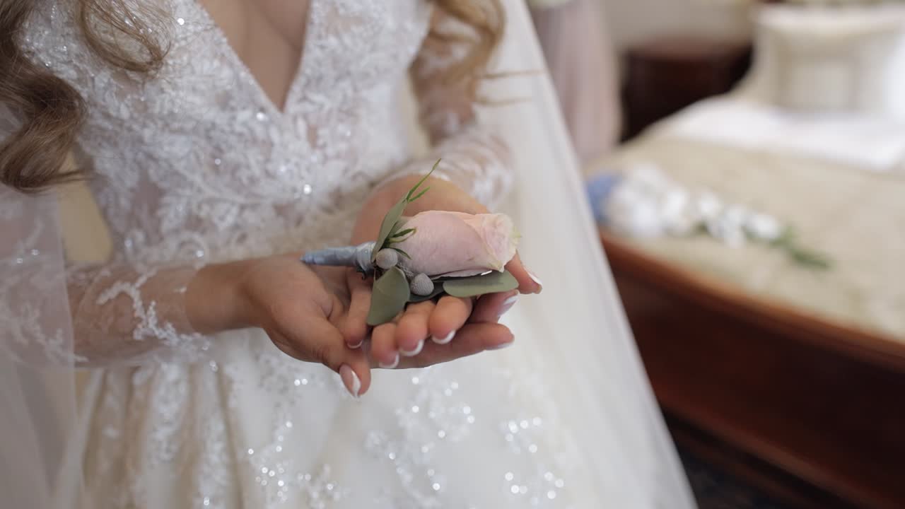 Bride holding a small rose bouquet
