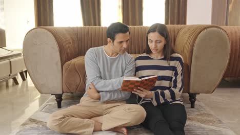 indian couple reading a same book