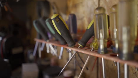 screwdrivers on work bench. slow motion camera dolly