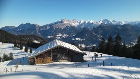 apline wooden cottage in the mountains orbiting shot around cabin