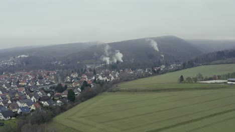 drone aerial view of the traditional german village herzberg am harz in the famous national park in central germany on a cloudy day in winter.