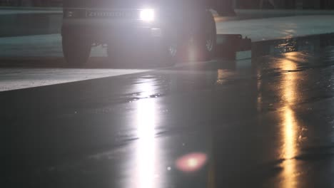 slomo low angle shot of zamboni smoothing ice rink