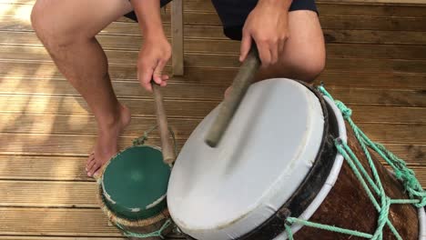 pacific island man play drum music