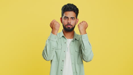 Aggressive-angry-Indian-man-trying-to-fight-at-camera,-shaking-fist,-boxing,-punishment,-threaten