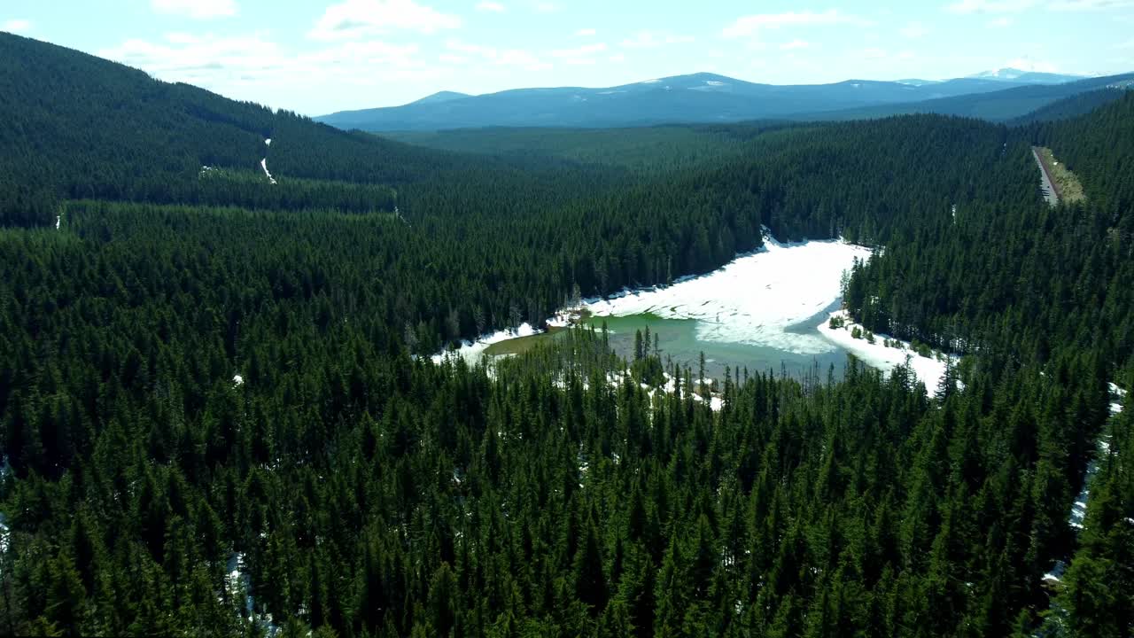 US, Oregon, Mt Hood, Frog Lake, 2025-04-22 - Drone view of Frog Lake near Mt Hood. On a spring day the lake is still covered in snow.