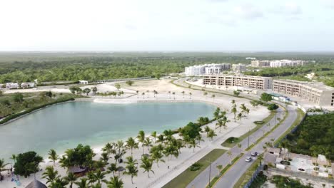 Dominican-Republic,-Punta-cana---2023---Panoramic-drone-view-of-an-urban-vacation-resort-with-beautiful-artificial-lake