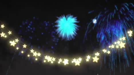 bursting blue fireworks over glowing star-shaped lights in night sky animation