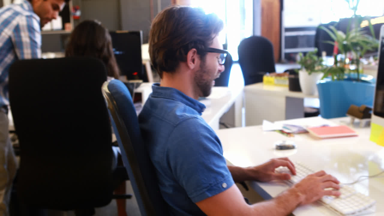 Businesspeople interacting and working