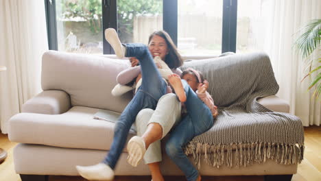 happy family having fun on a sofa at home