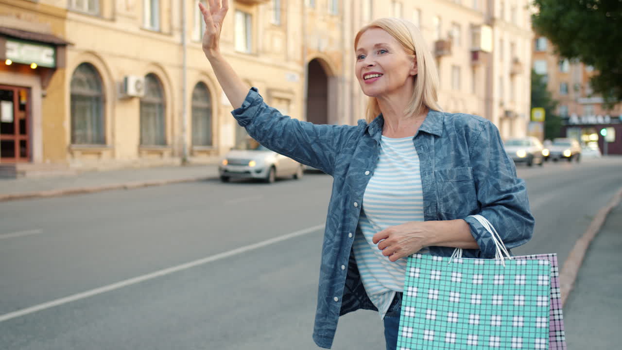Woman Waiting for a Taxi with Shopping Bags