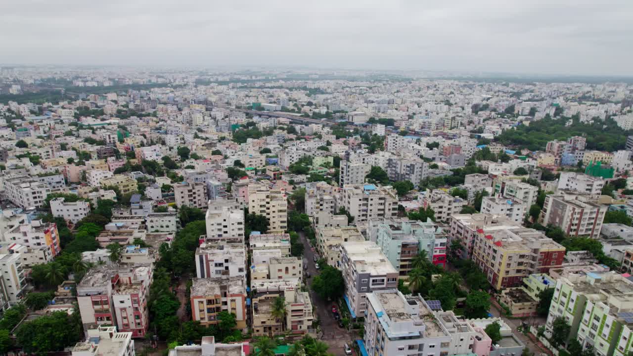 Aerial View of Urban Cityscape with Residential Buildings and Roads. day time, push in, drone shot, 4k