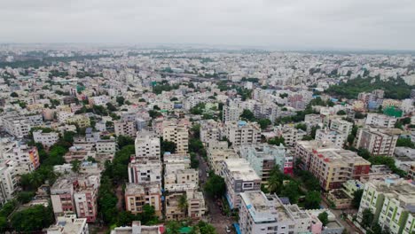 aerial view of urban cityscape with residential buildings and roads. day time, push in, drone shot, 4k