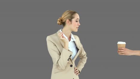 businesswoman yawning and then being handed a coffee