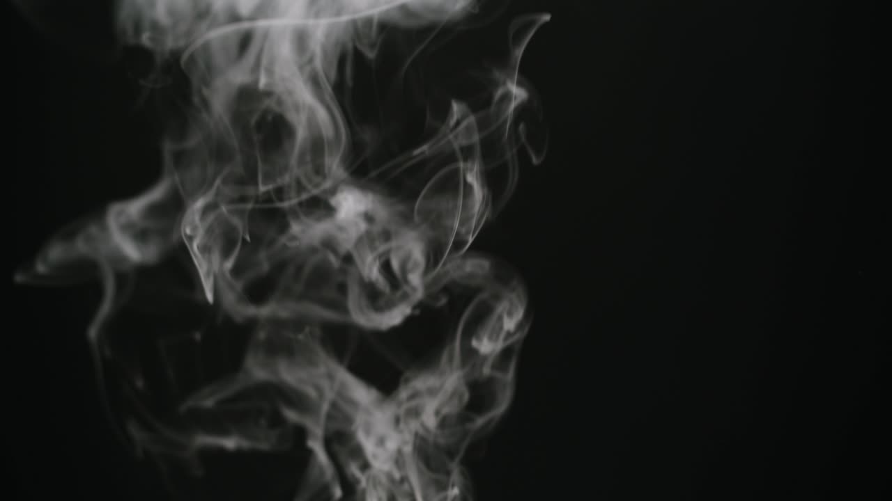 White Smoke Rising and Flowing on Black Background
