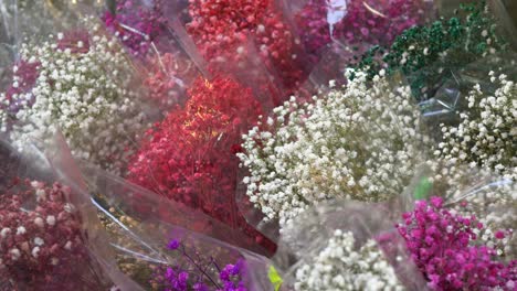 colorful baby's breath bouquets in plastic wrap