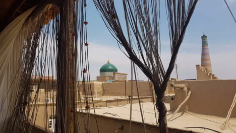 Khiva-Old-Walled-City-View-From-Window-With-Authentic-Oriental-Curtains,-Uzbekistan