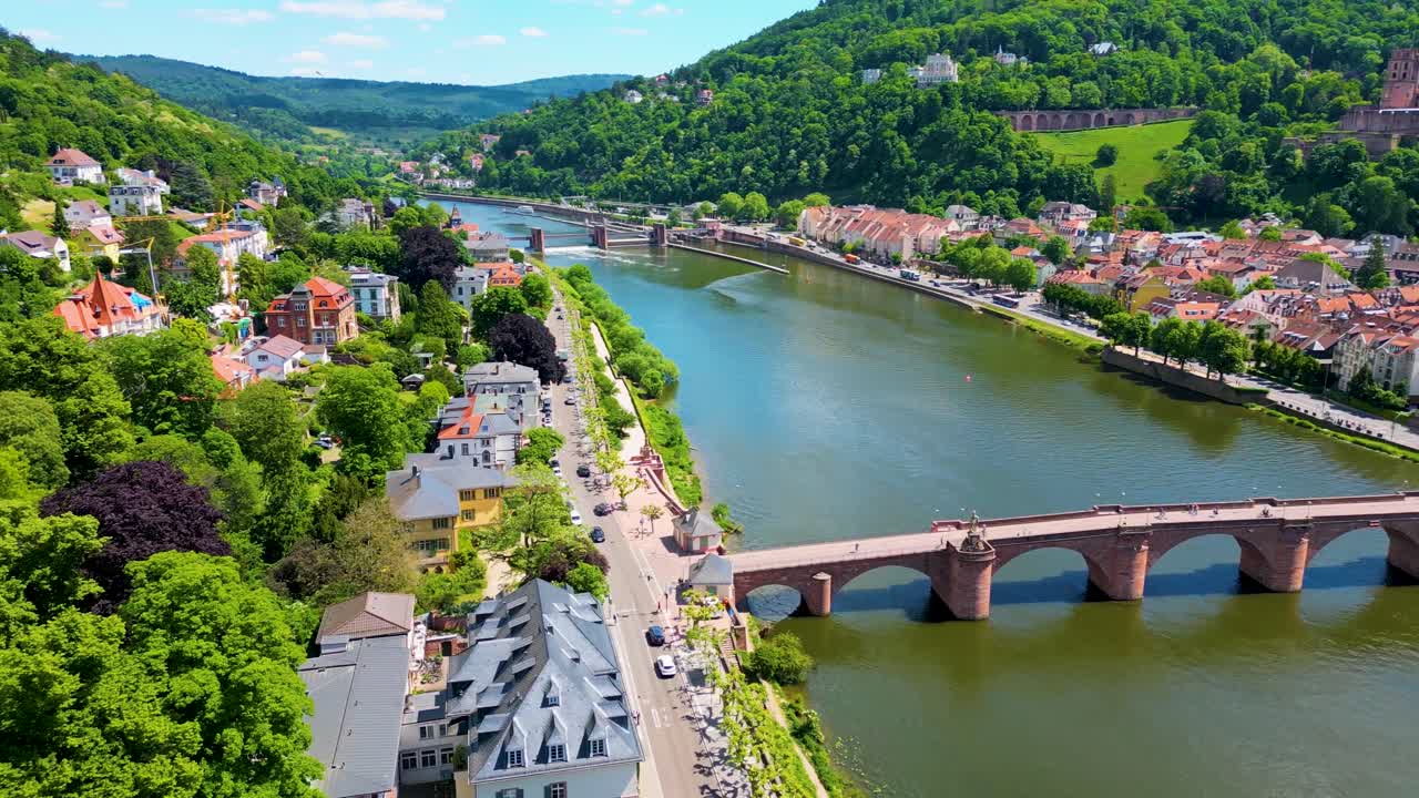 4K Aerial Drone Video of Historic Heiliggeistkirche Church, Castle on Königstuhl Hill, and Old Bridge on the Neckar River in Heidelberg, Germany