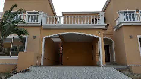 establishing shot of a brown home in bahria town, pakistan