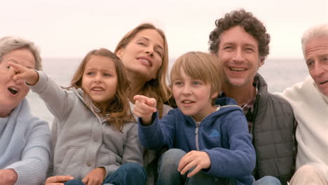 family sitting and pointing