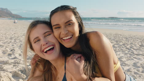 young woman hugging girl friend on beach giving suprise hug best friends having fun summer vacation