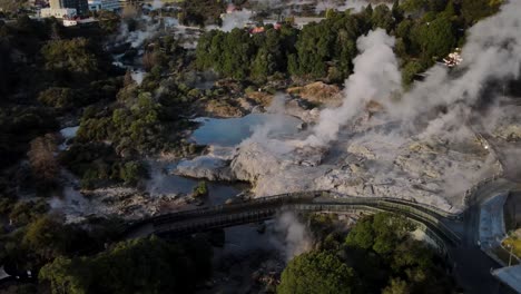 Outstanding aerial reveal of Whakarewarewa Thermal Valley and main Pohutu Geyser, New Zealand