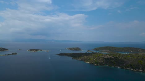 rotating drone clip over a beatiful formation of islands in the bay of vourvourou, halkidiki, northern greece