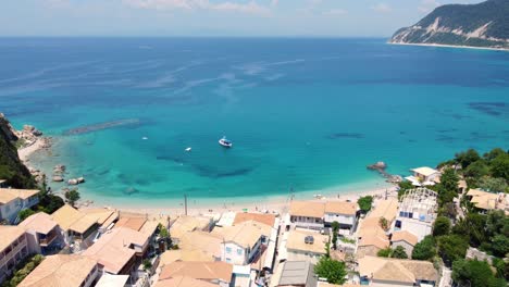 Beautiful-Coastal-Village-Agios-Nikitas-at-Lefkada-Island,-Greece---Aerial