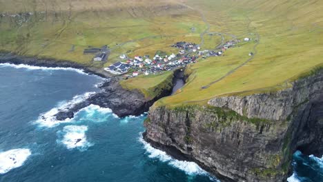 wide drone footage of the gjogv village on the eysturoy island in the faroe islands