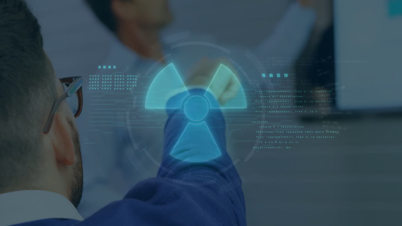 Pointing at digital nuclear symbol with data overlay, person in office environment
