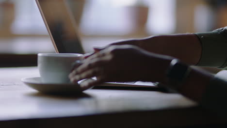 business woman hands using laptop computer in cafe drinking coffee typing email messages working late sharing networking ideas enjoying online social media communication close up