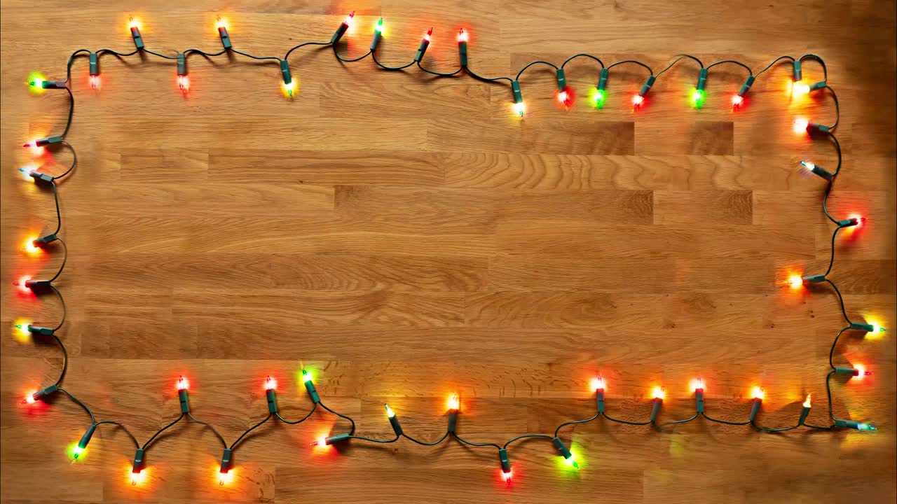 Colorful string lights turning totally on and off with an emtpy space at the center to be able to be filled. Loopable