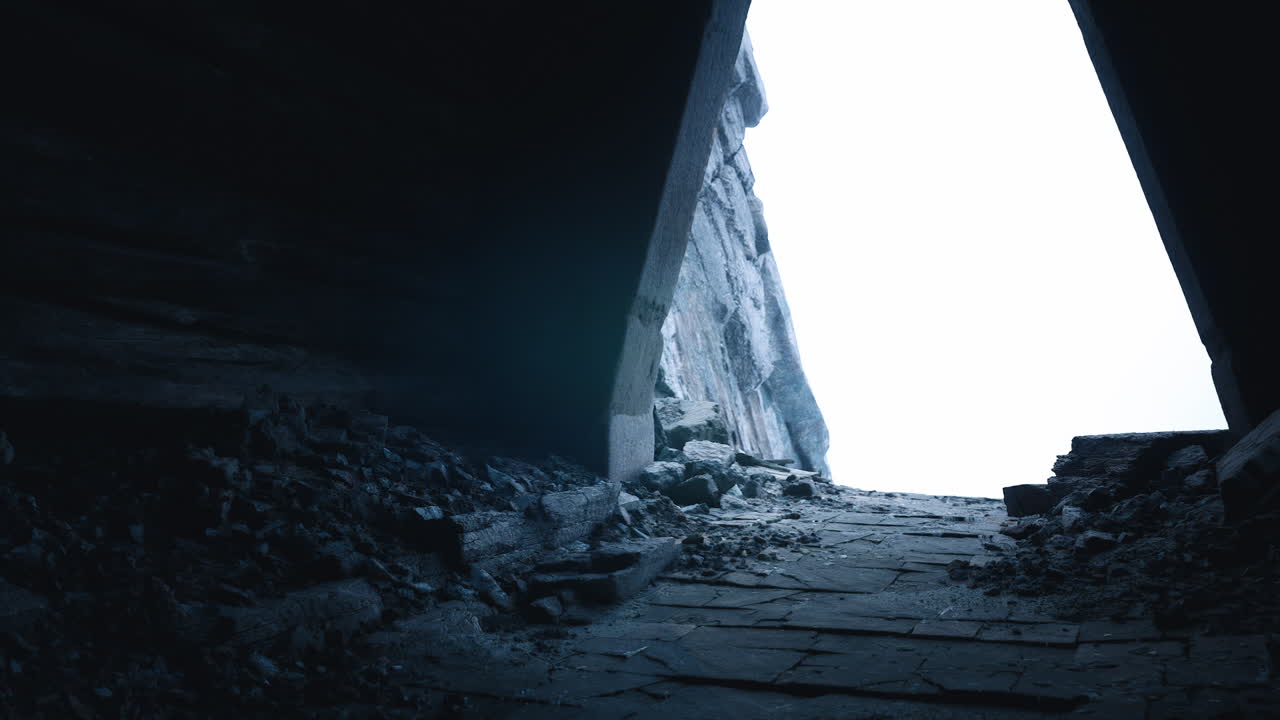 Exploring a dark passage leading to a bright opening in ancient ruins