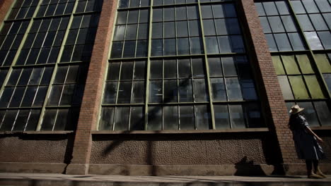 Romanian-girl-walking-in-front-of-the-factory---Romania