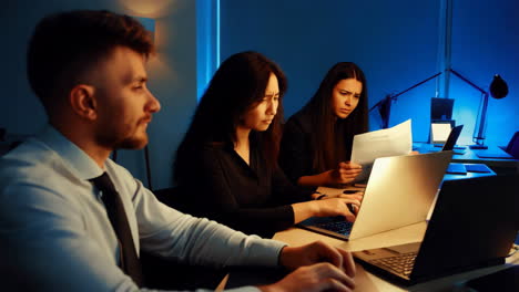 business team working late night in office