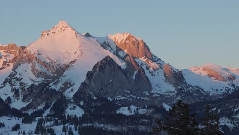 Silhouette-of-snow-capped-mountains-captured-by-a-drone-at-dawn