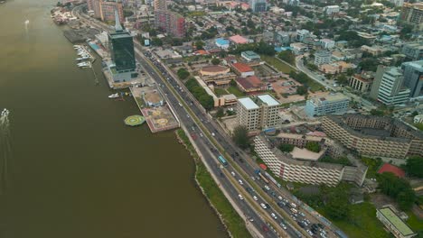 traffic and cityscape of falomo bridge, lagos law school and the civic centre tower in lagos nigeria