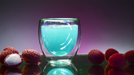 vibrant blue lychee juice in glass