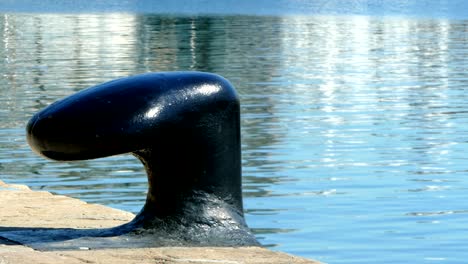 old bollard on the seaport of barcelona