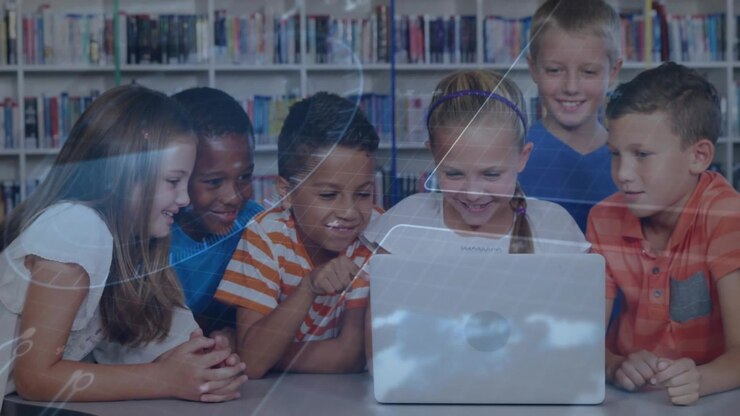 Students gathering around shiny laptop, boy pointing and activating overlay lines for education