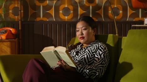 woman reading in a retro living room