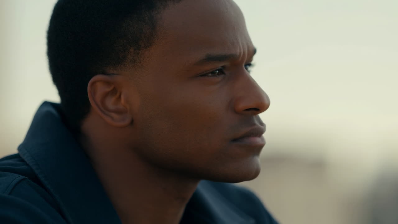 Close Up Profile of a Thoughtful Young Black Man