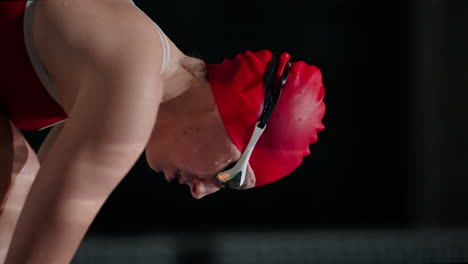 swimmer at the starting block, ready to compete