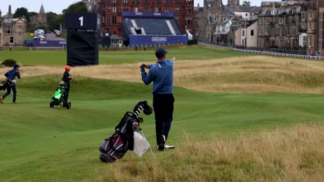 golfer taking a swing at st andrews