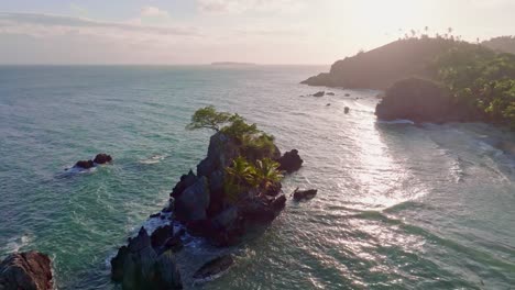 Aerial-view-of-PUNTA-BALANDRA-with-tropical-coastline-during-golden-sunset-at-horizon---Samana,-Dominican-Republic