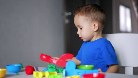 game education for little boy. small kid playing with colourful toys.