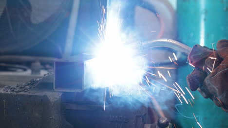 welding metal tube with a mig welder, closeup shot