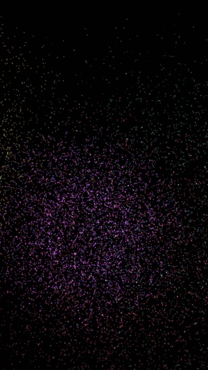 Esplosioni di particelle vivaci e multicolori esplodono e svaniscono su uno sfondo nero in questa animazione verticale.