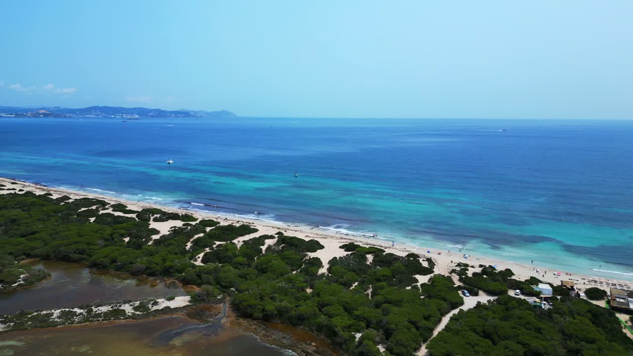 stunning beauty of Cavallet beach, with its turquoise waters and white sand, in Ibiza, Spain. Nice aerial view flight overflight flyover drone
