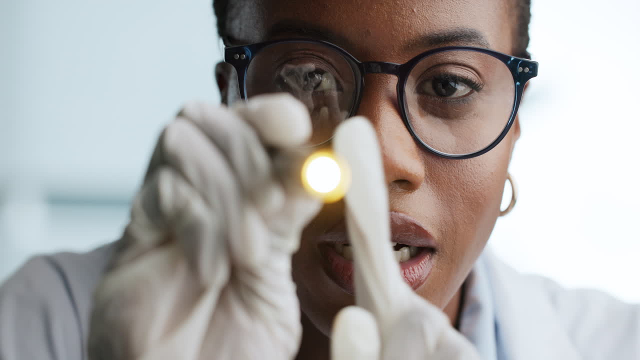 Doctor performing eye exam with flashlight